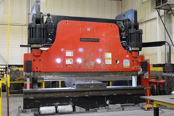 A large hydraulic press brake for forming components used in large tooling and flight hardware for the aerospace, defense, and space industry