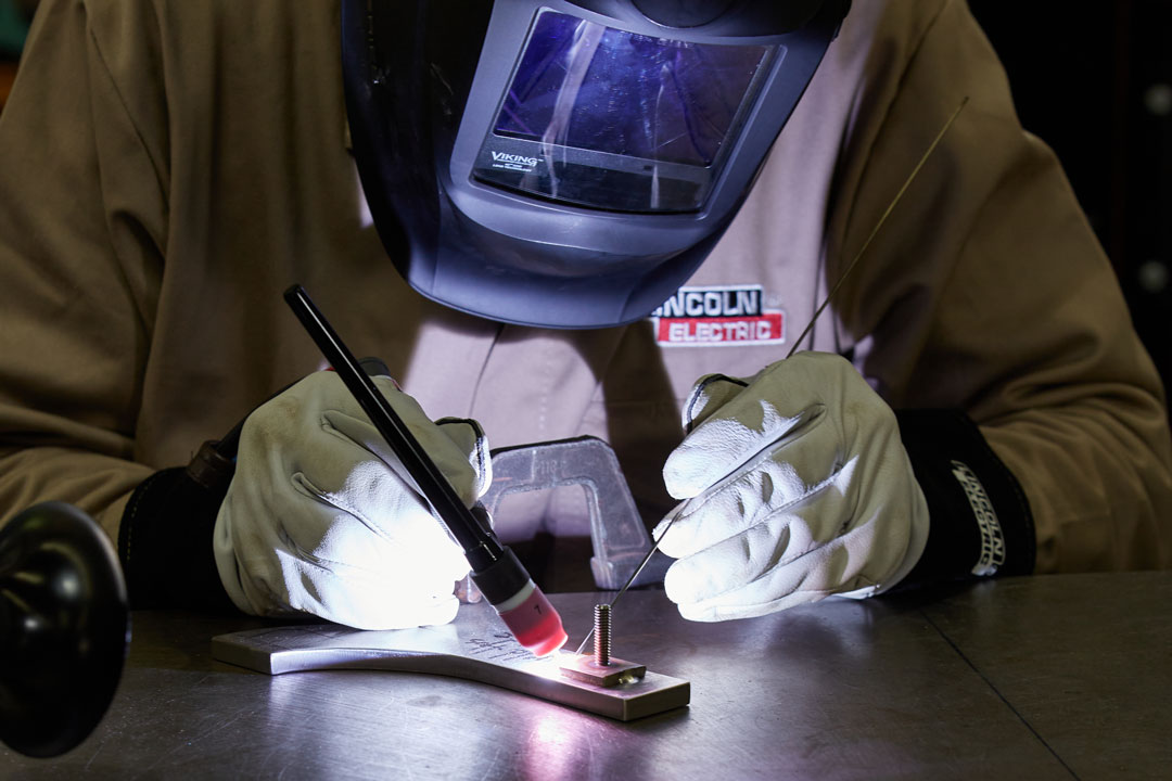 A fabricator TIG (GTAW) welding a component for large tooling or flight hardware for the aerospace, defense, and space industry