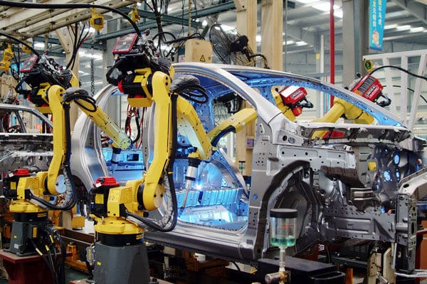 An automotive manufacturing assembly line with robotic welders