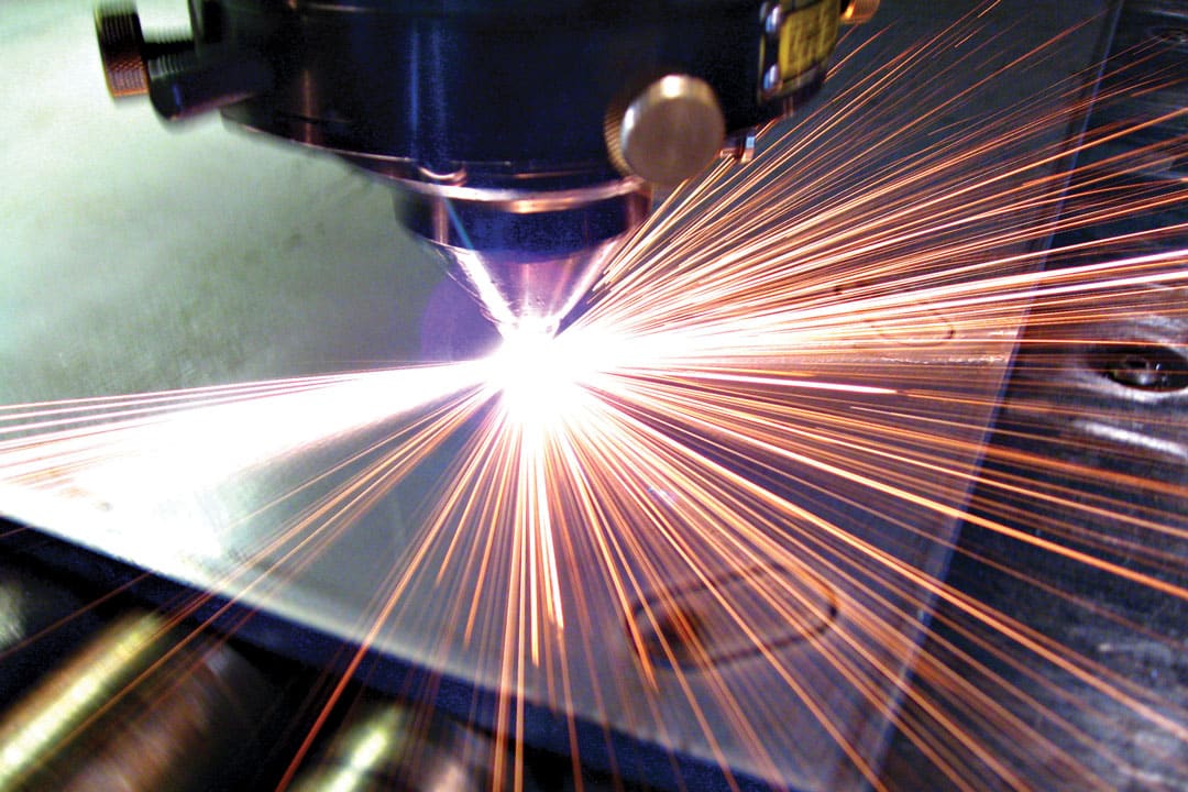 A laser cutter cutting a component for large tooling or parts for the heavy equipment industry