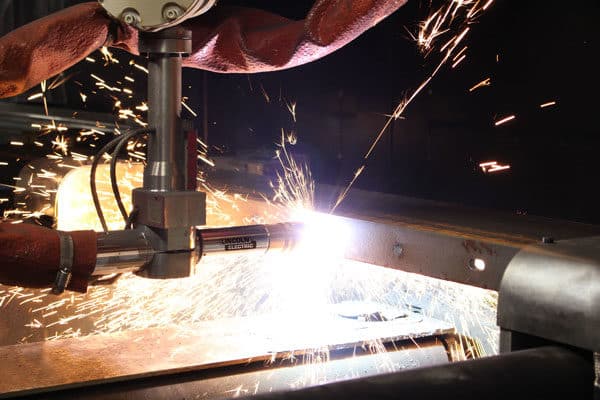 An automated cutting system cutting a large piece of steel for the shipbuilding industry