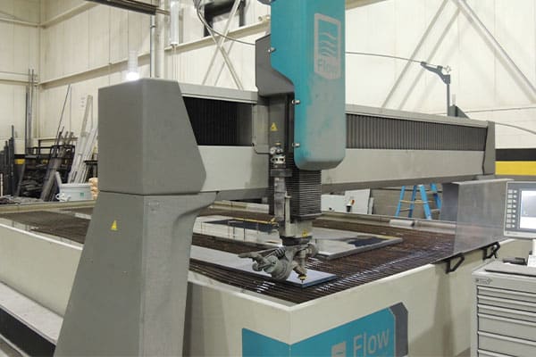 A Flow five-axis large waterjet cutting machine at Baker Industries