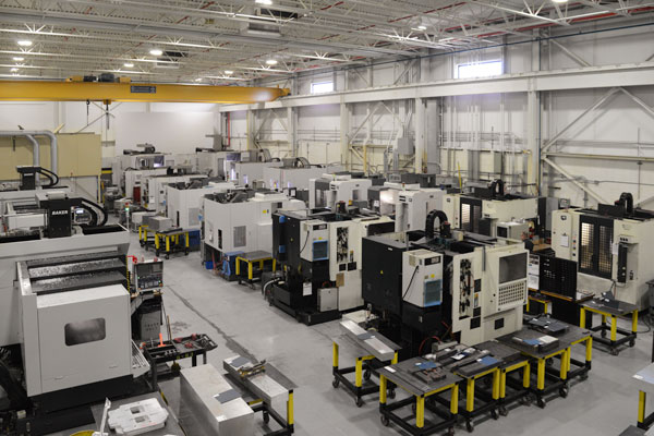 An overhead shot of small and medium five- and three-axis CNC machines at Baker Industries