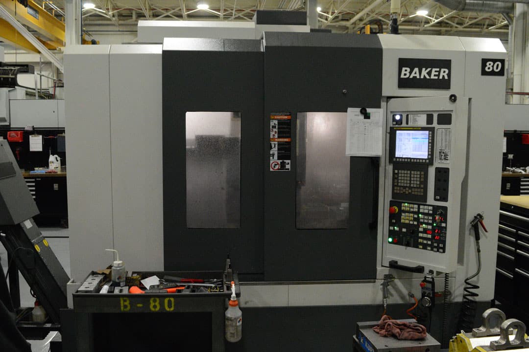 A YCM NSV102A three-axis CNC machine at Baker Industries